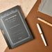 Apica Premium C.D. Notebook displayed with fine writing pens on desk