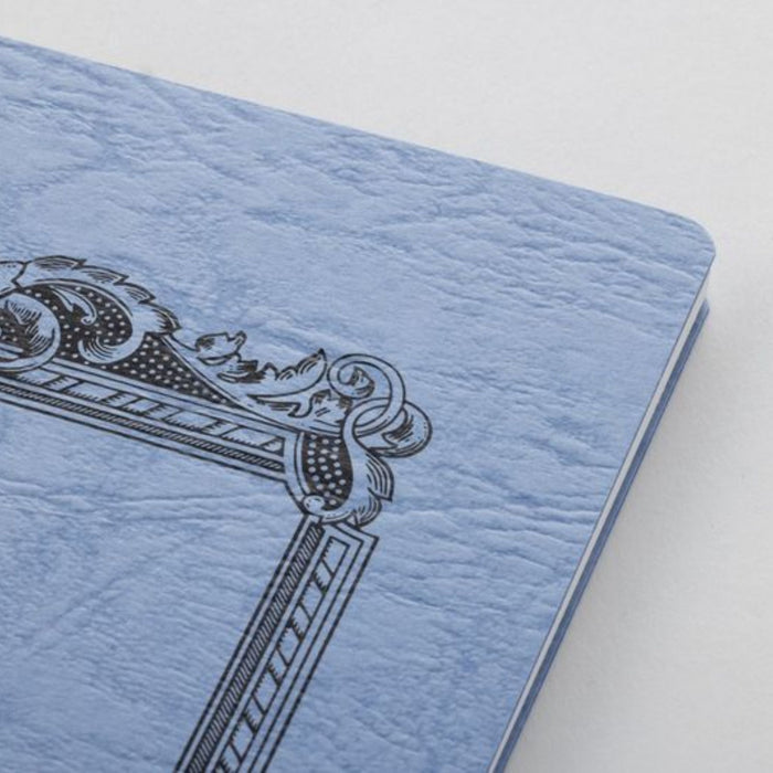 Close-up of Wisteria Apica CD Twin Ring Notebook cover texture and printed frame design