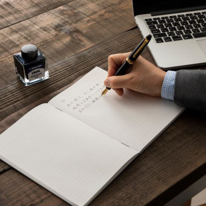 Writing in Apica Premium C.D. Notebook with fountain pen on smooth ruled paper
