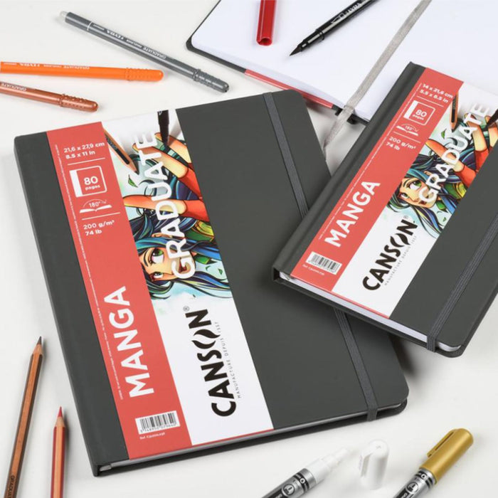 Canson Graduate Manga Sketchbooks with markers, pencils, and drawing tools on a white background