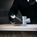 Applying MTN WEPRO Universal Primer spray to a non-absorbent surface before painting
