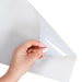 Clear inkjet transparency sheet being held to show flexible transparent film