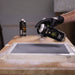 Applying MTN WEPRO Gesso Primer in thin even coats on a panel