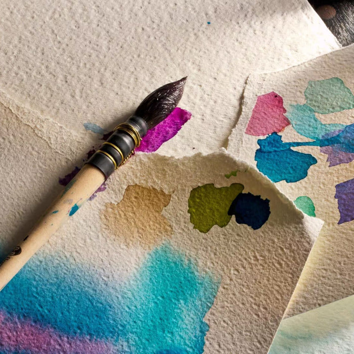 Close-up of Fabriano Artistico 100 percent cotton cold press watercolour paper texture with paint samples