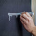 Artist creating paint drips using Montana Colors Street Dabber marker