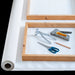 Canvas stretching tools including pliers, stapler, and stretcher bars
