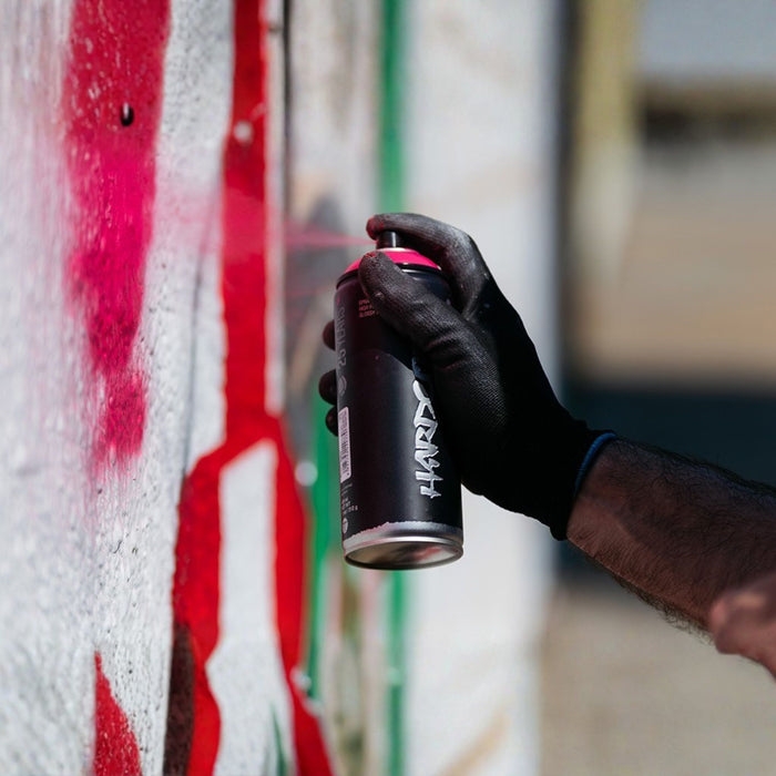 MTN Hardcore spray paint in use creating vibrant graffiti artwork on a wall