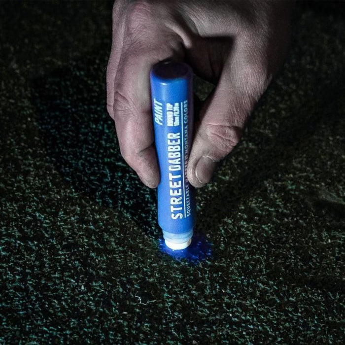 Close-up of Montana Colors Street Dabber applying paint to textured surface