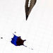 Fountain pen nib writing with blue-black ink on paper