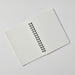 Inside pages of Apica CD Twin Ring Notebook showing lined fountain pen friendly paper and lay-flat binding