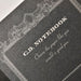 Detailed view of Apica Premium C.D. Notebook embossed cover and decorative frame