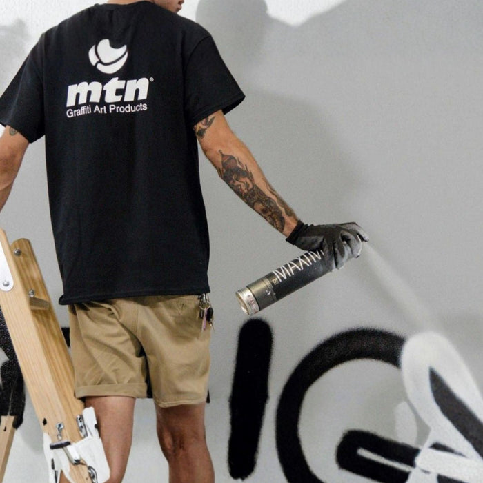 MTN Maximo 750ml spray paint being applied to a large wall mural with high-pressure aerosol coverage